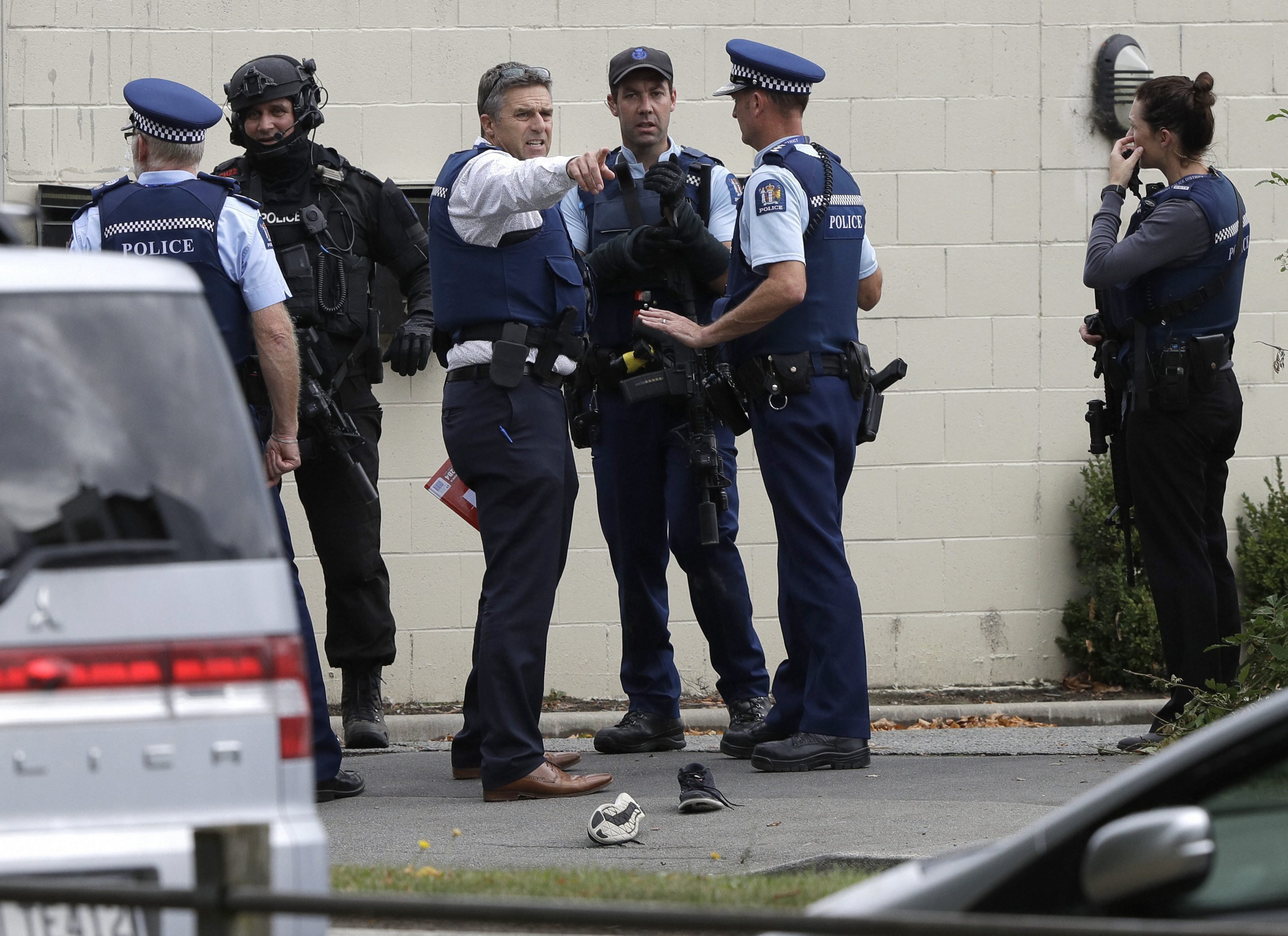 49 killed in New Zealand mosque shootings; 4 held