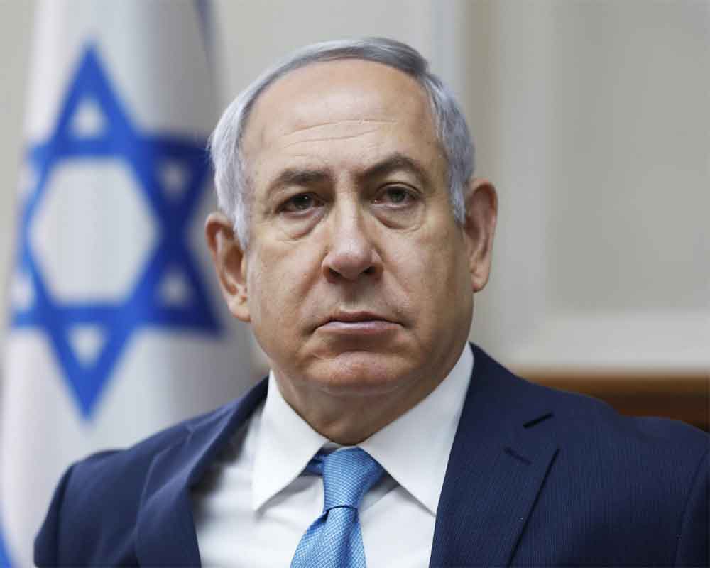 Israeli PM Netanyahu freezes judicial overhaul; urges protesters to behave responsibly