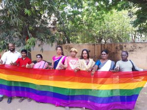 LGBTQIA activists with the rainbow flag - The Federal