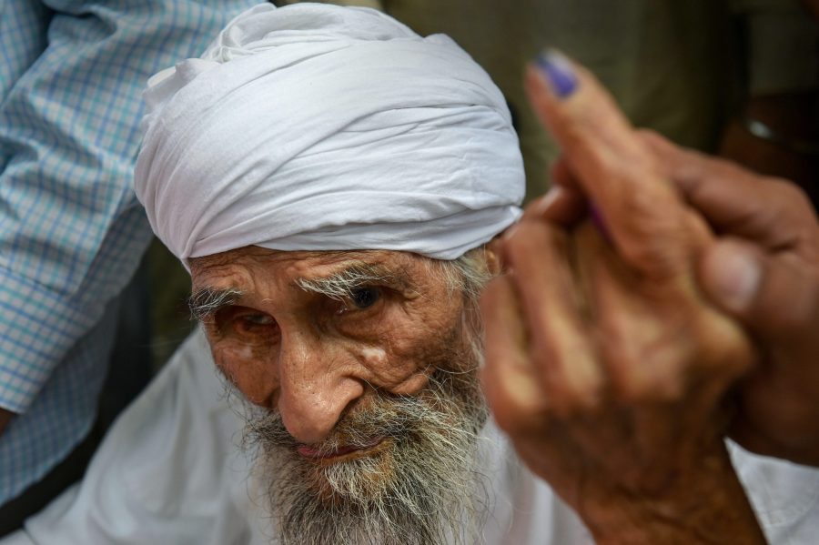 111-year old Bachan Singh, the oldest voter in Delhi casts vote