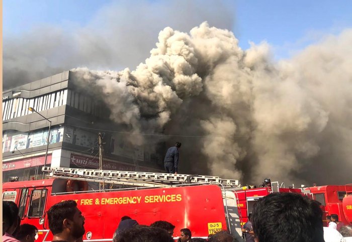 Daily wrap: 15 die in Surat fire; May resigns; Odisha Cong chief quits Daily wrap: 15 die in Surat fire; May resigns; Odisha Cong chief quits