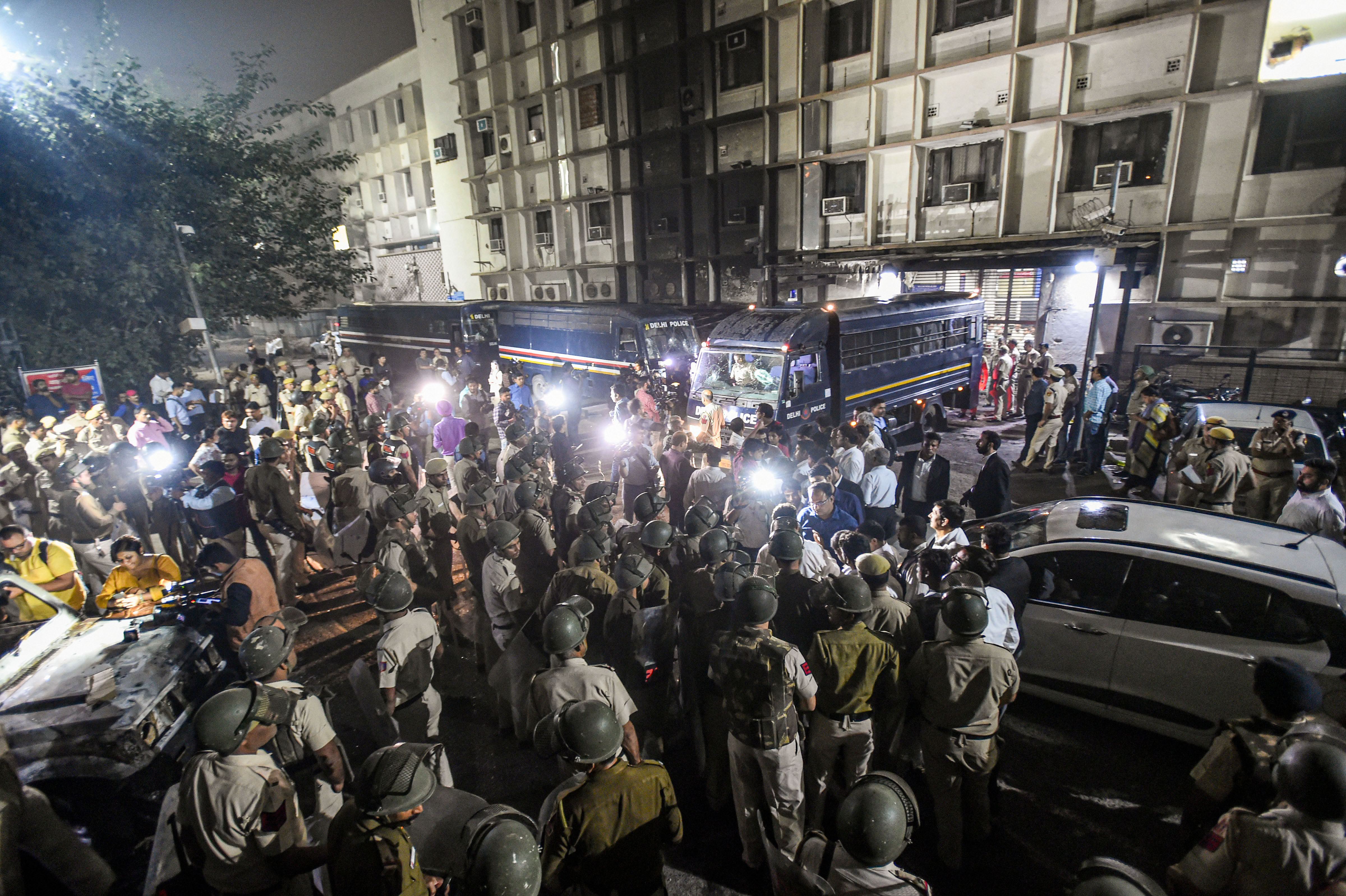 Angry lawyers gather outside district courts in Delhi