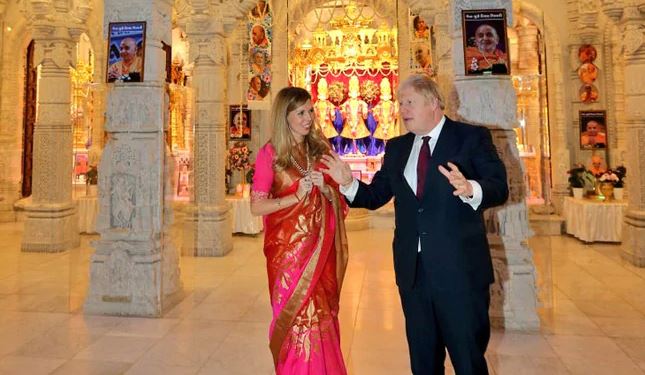 Boris Johnson visits Hindu temple, vows to partner with Modi to build new India