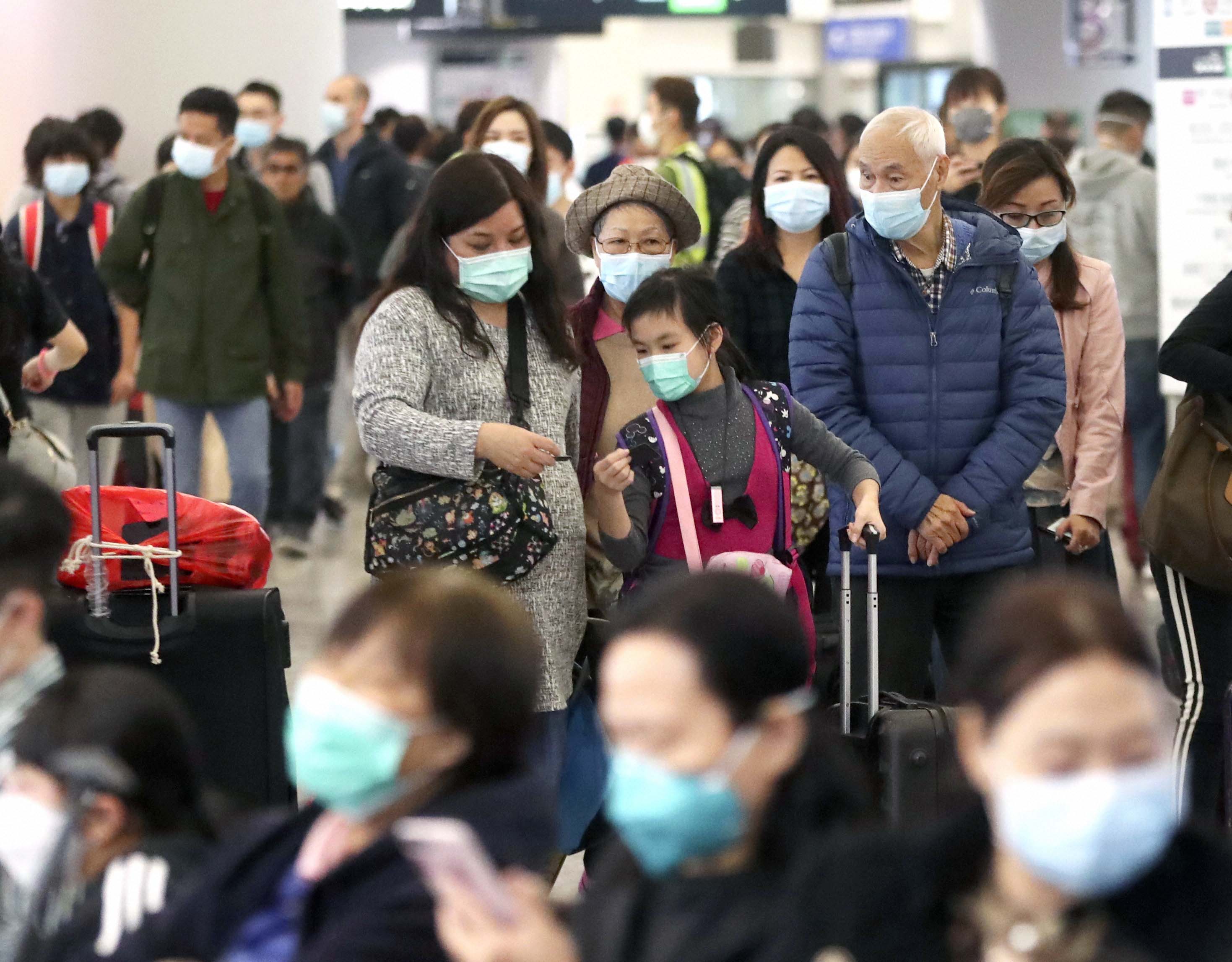 China orders nationwide measures to detect virus on flights, trains, buses