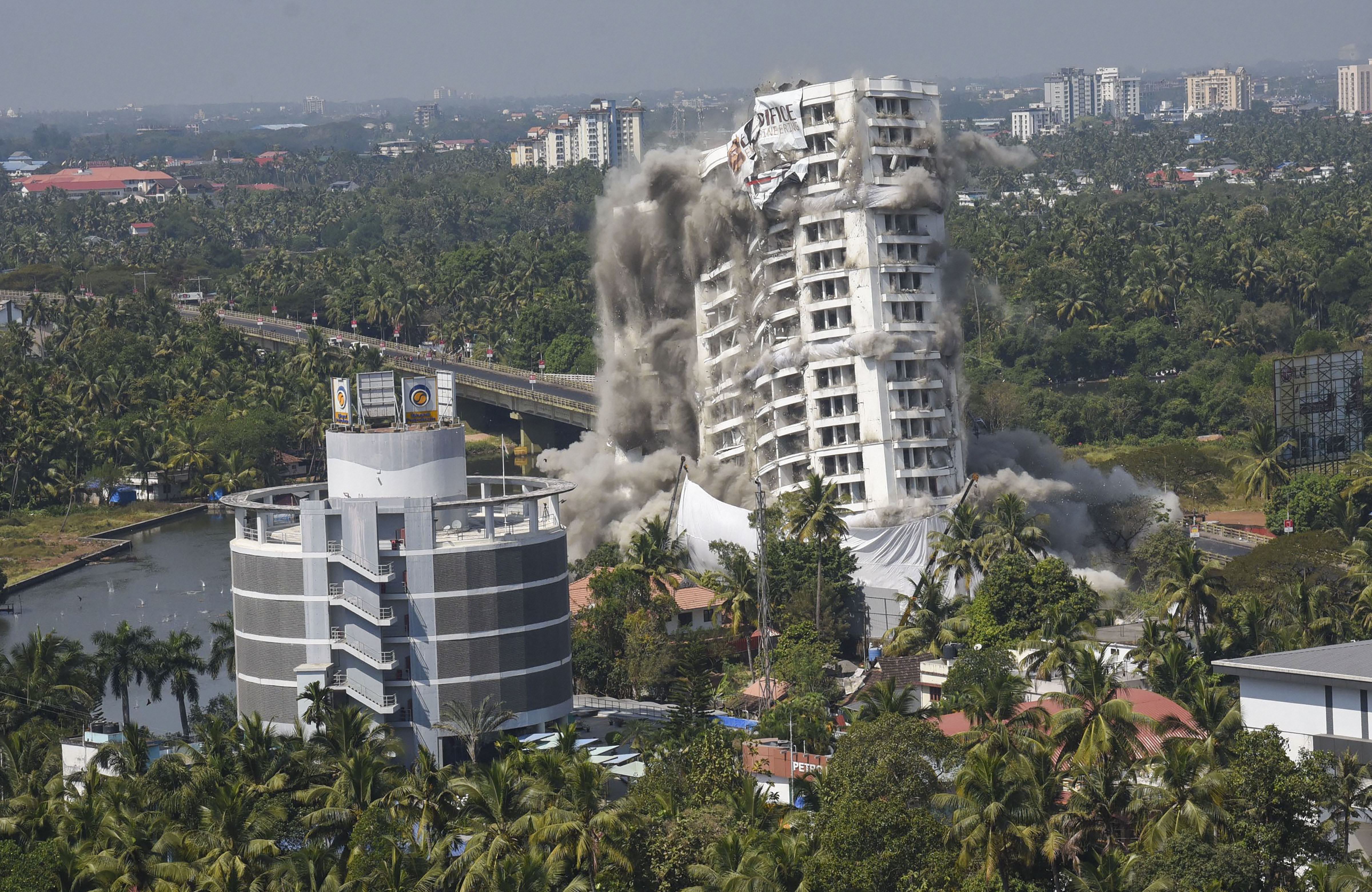 A day after demolition of flats, locals complain about dust