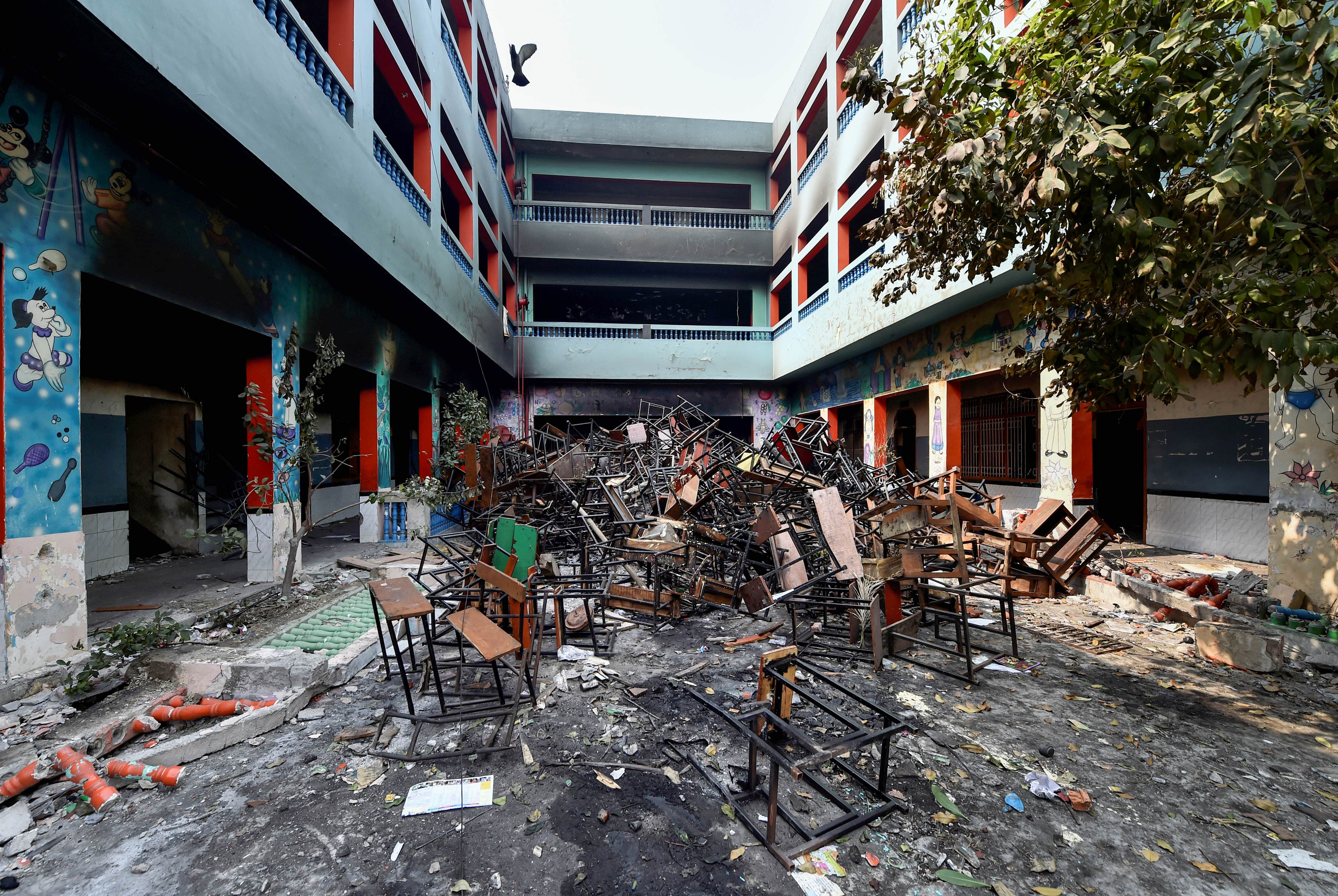 Burnt books, half-charred boards tell tales of vandalised schools in Delhi