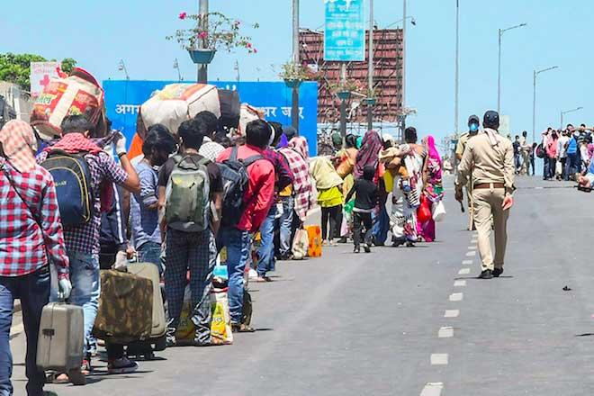 Migrant workers hurl stones at cops in Gujarat, demand transport
