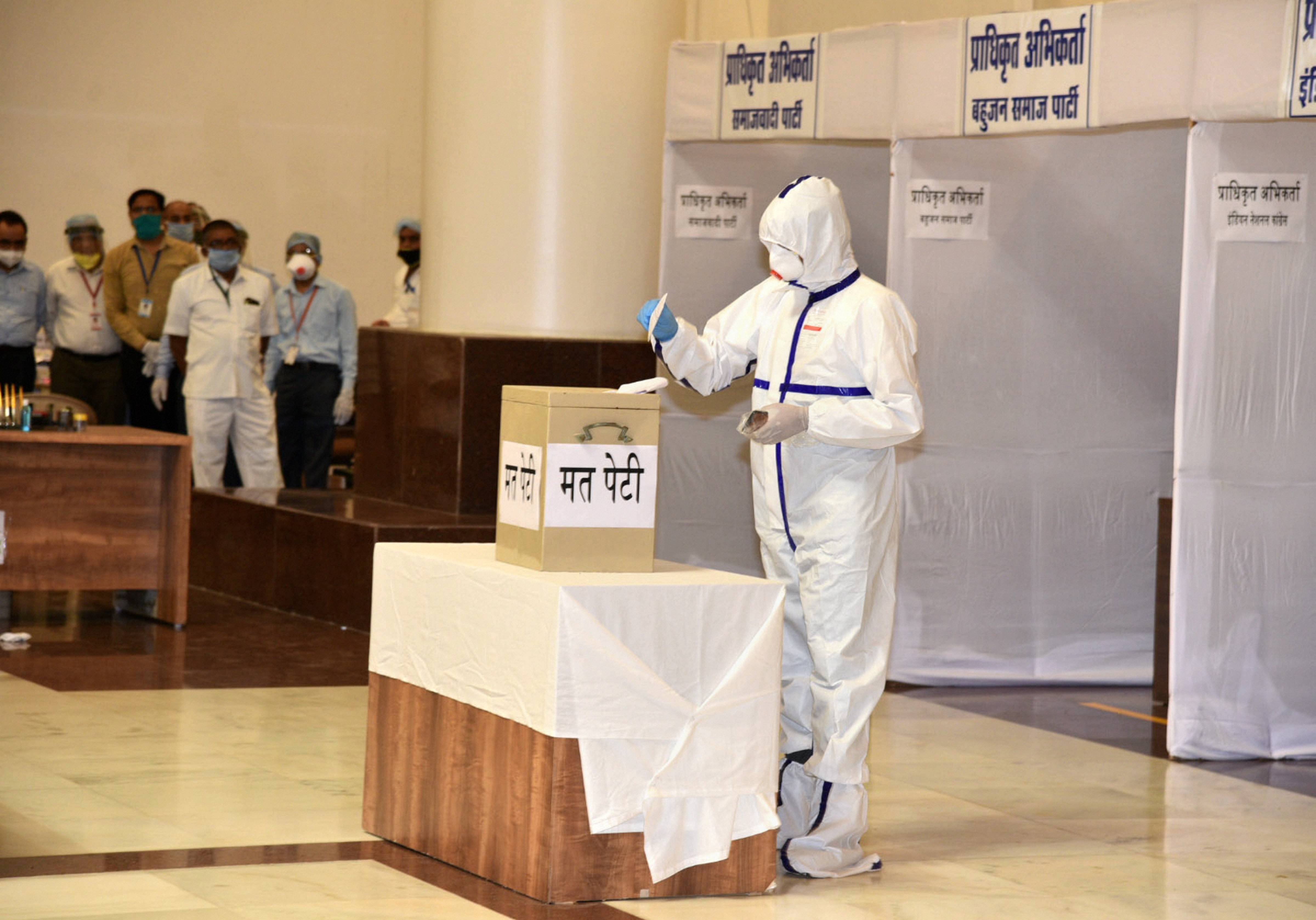 Rajya Sabha polls: COVID-19 infected MLA votes wearing PPE suit in MP