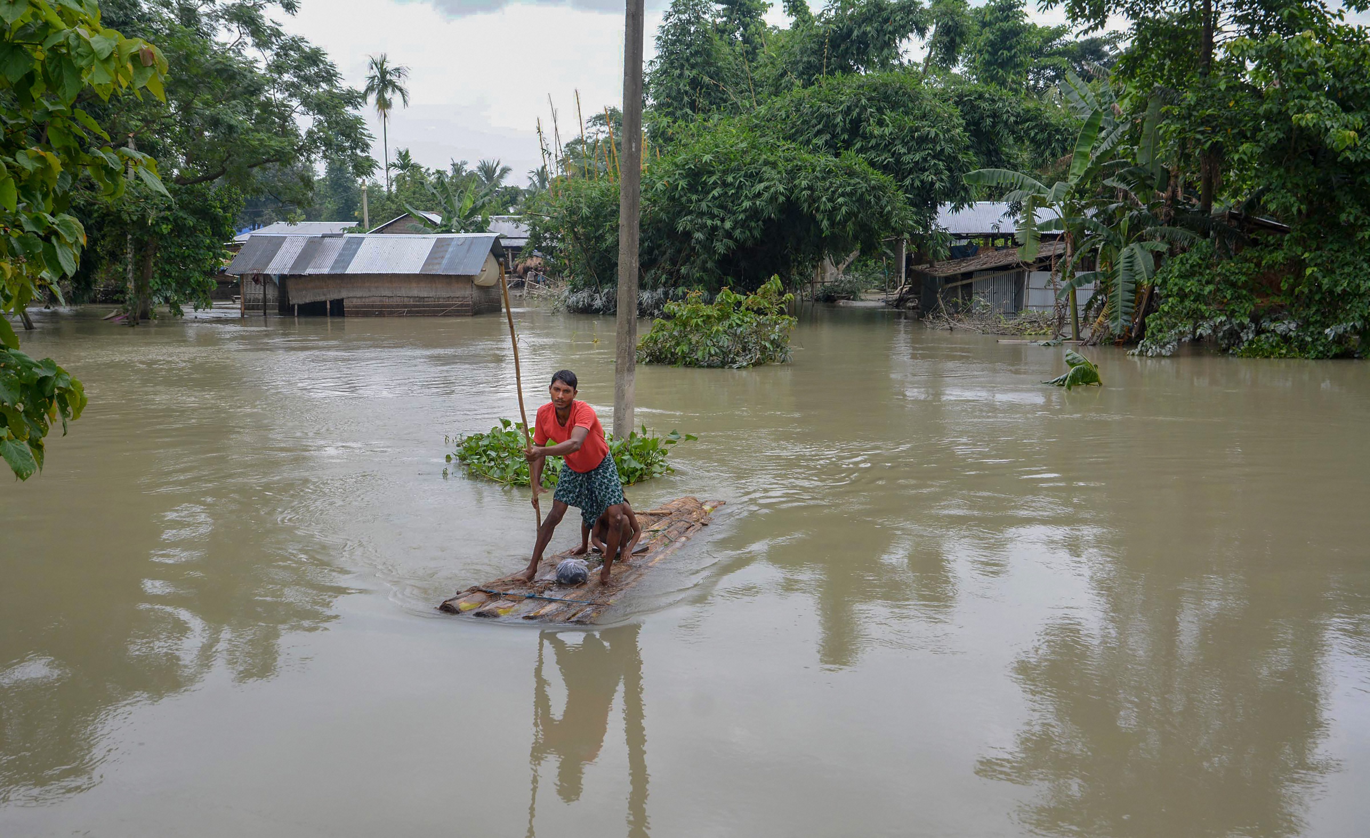 As north and central India burn, heavy rainfall in north-east leads to floods in Assam