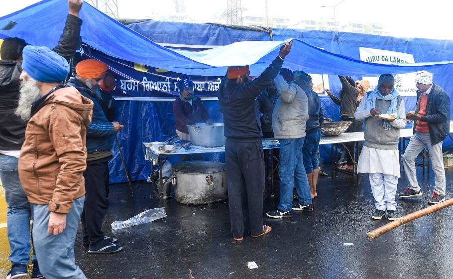 Tents waterlogged, blankets soaked, but farmers determined