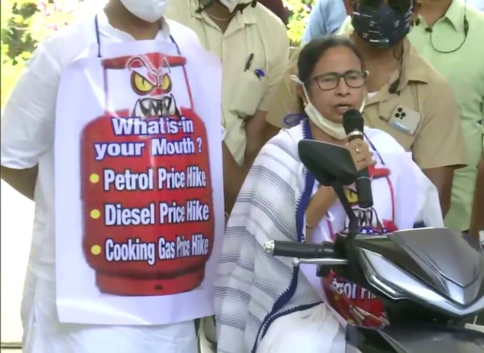 Mamata Banerjee rides pillion on electric scooter during  fuel price protest rally