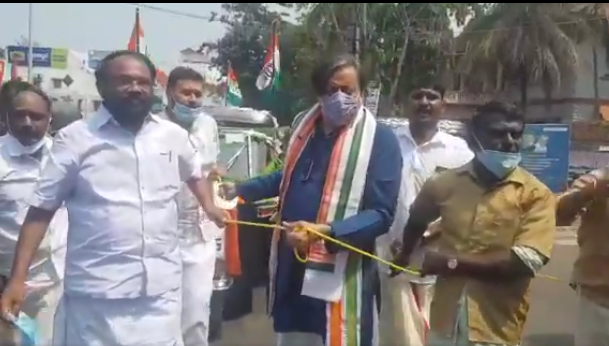 Shashi Tharoor pulls autorickshaw with rope to protest rising fuel prices