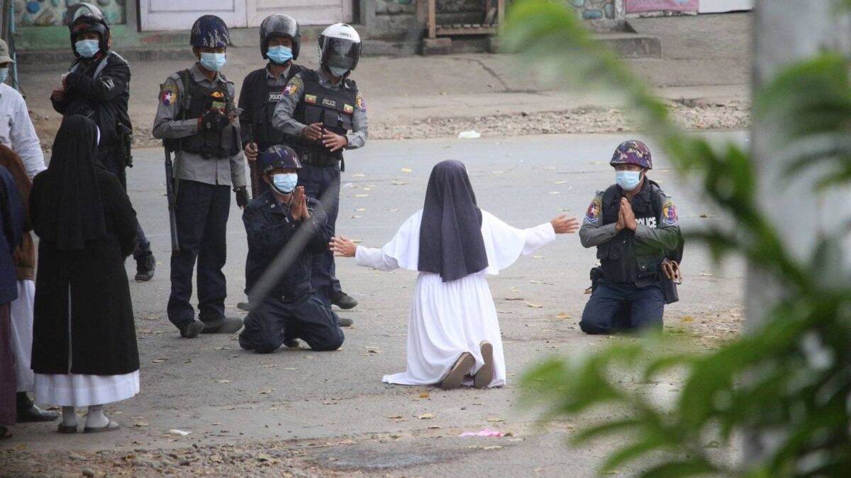 Nun goes to her knees to stop Myanmar police from shooting children