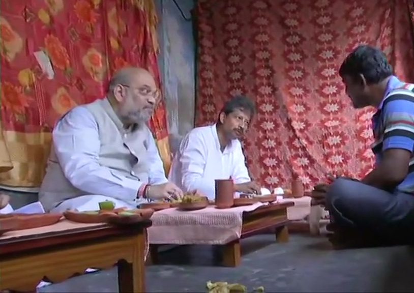 Shah dines at rickshaw-puller’s house, takes potshots at Mamata