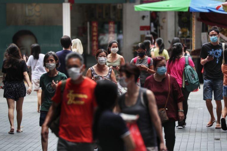 With rising infections, Singapore sounds out a COVID spike warning