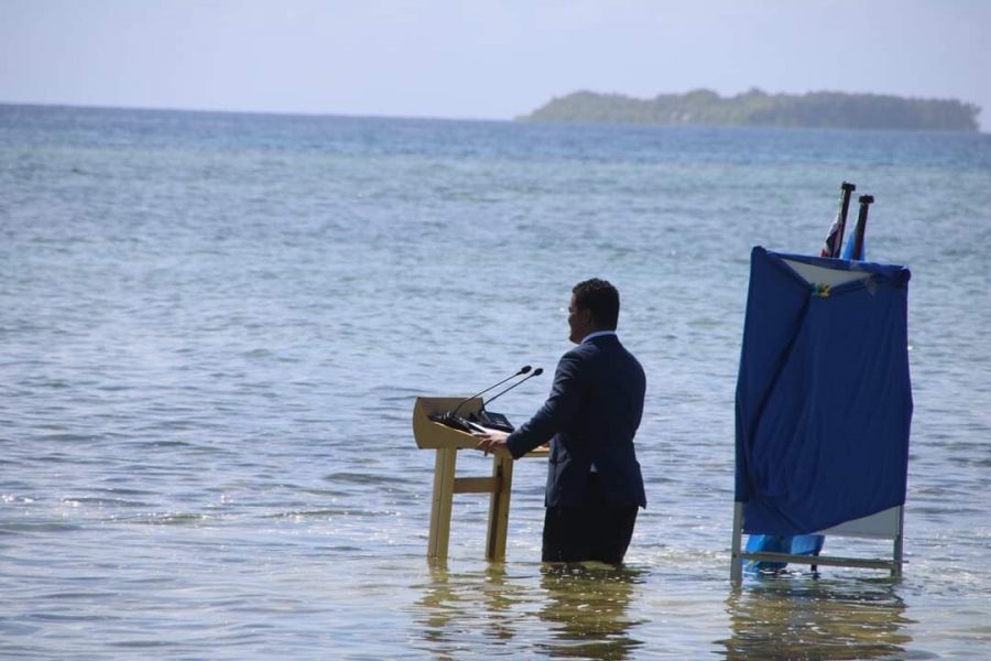 Island nations minister delivers in-water speech on climate crisis. But why?