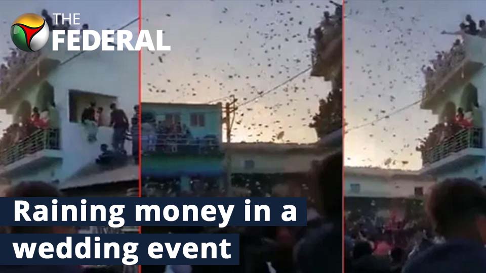 Family showers cash at a wedding event in Gujarat