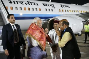 Bommai receives Modi in airport