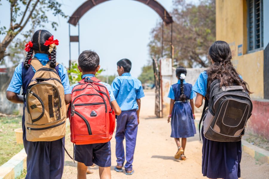 School children with outlet bag