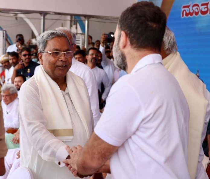 Karnataka CM Siddaramaiah is greeted by Rahul Gandhi