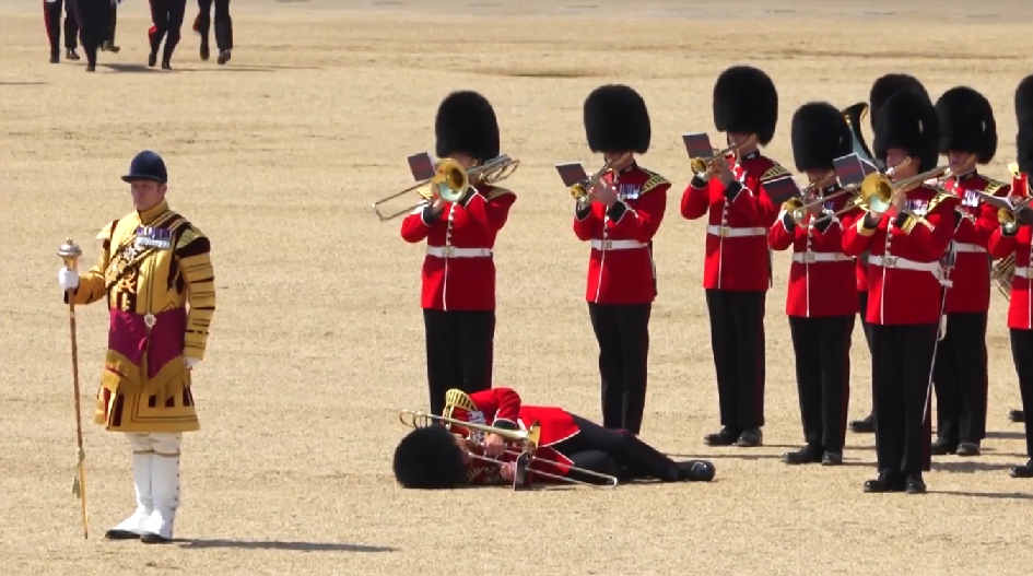 British soldiers feel the heat, several faint, as Prince William reviews military parade