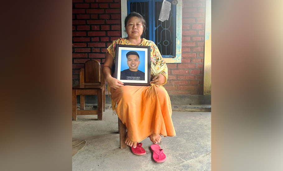 Laishram Rivaldo Meitei’s mother with the photos of her deceased son.