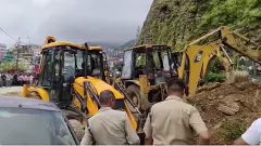 The State Disaster Relief Force has deployed excavator machines to carry out search and rescue. (Pic: ANI)