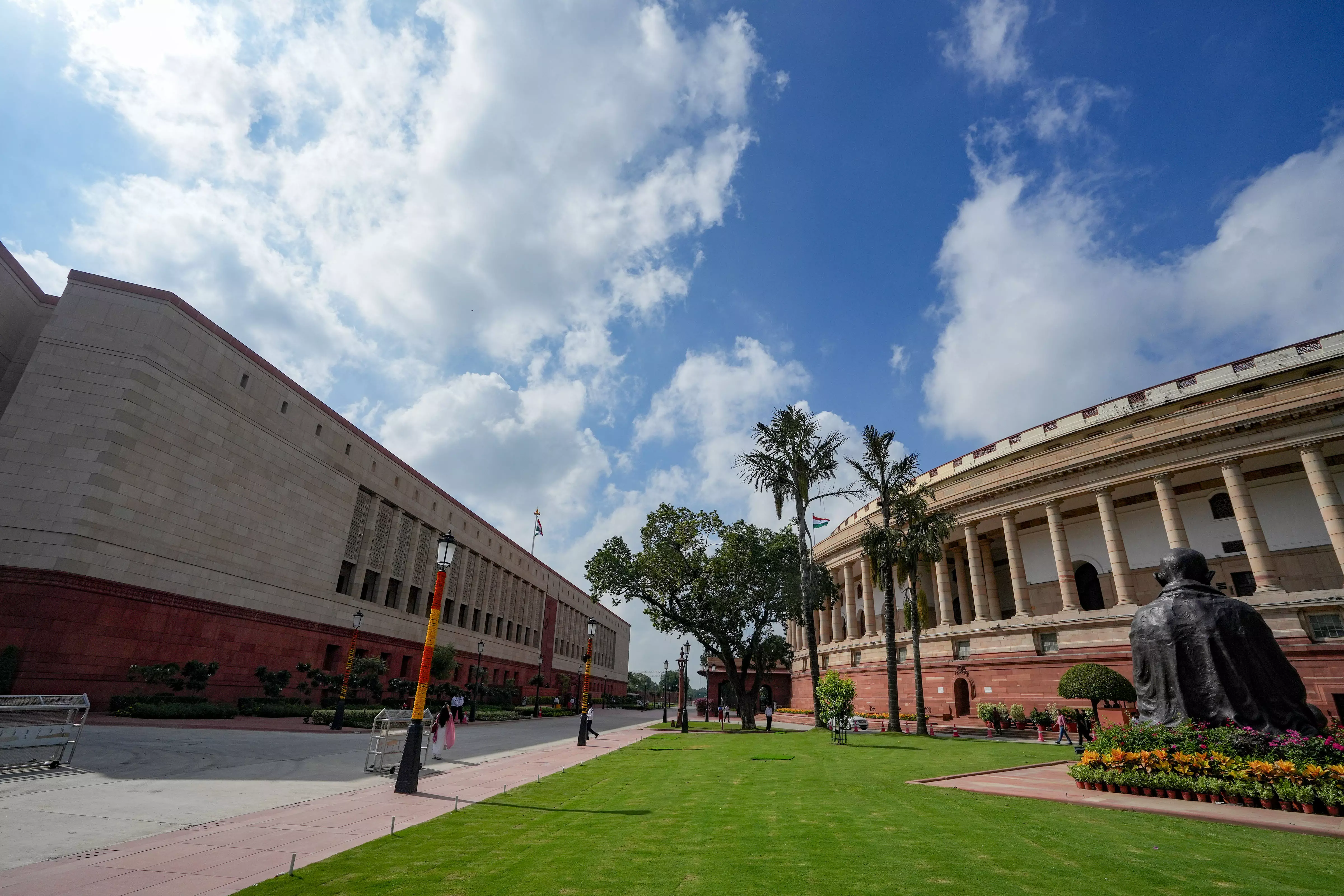 Clouds hover over the old and new Parliament buildings on the first day of the Special session of Parliament, in New Delhi, Monday, September 18. Photo: PTI