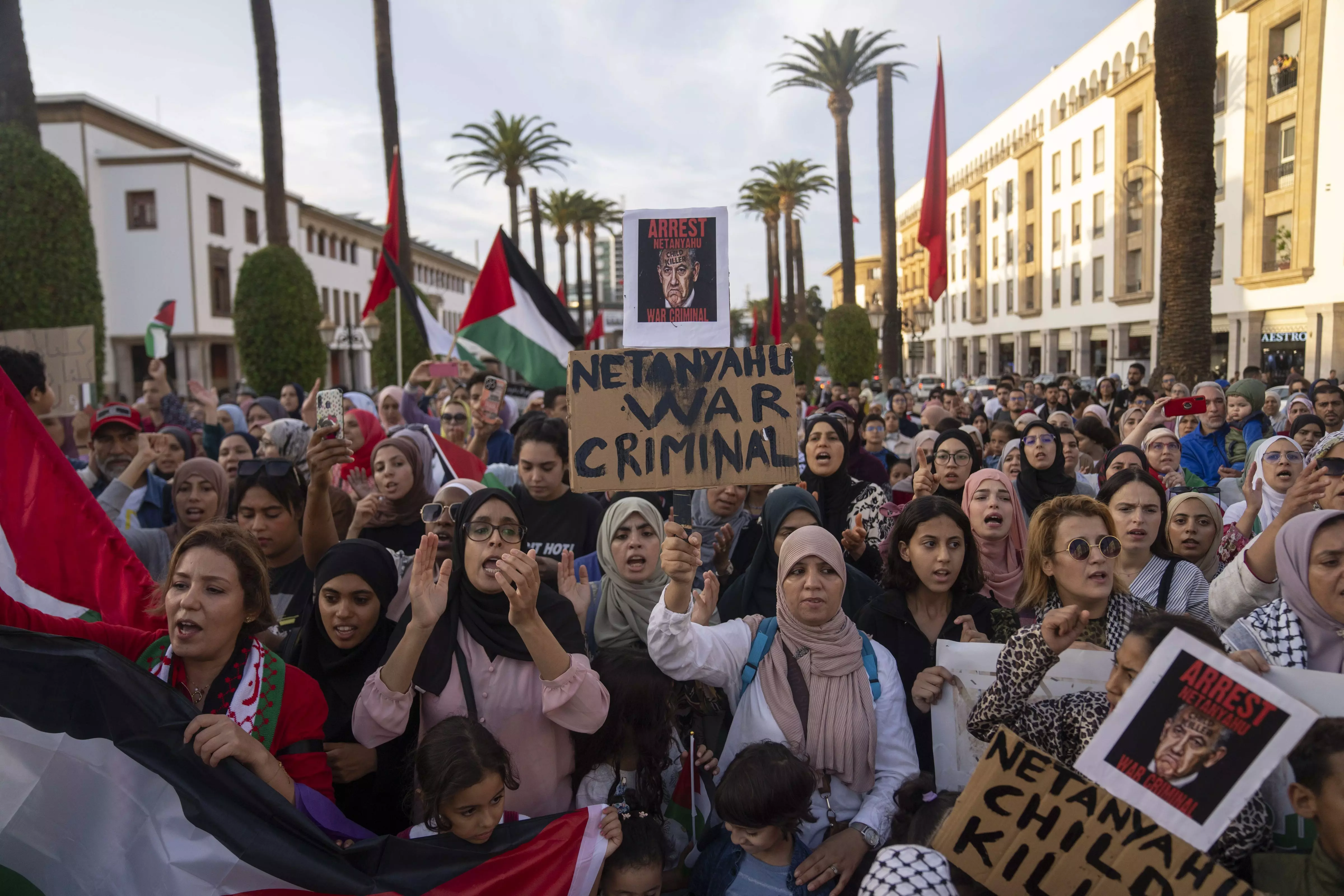 Hundreds of Moroccans carry Palestinian flags and shout slogans as they gather in solidarity with Palestinians in Gaza, in Rabat, Morocco, on Oct 18 | AP/PTI