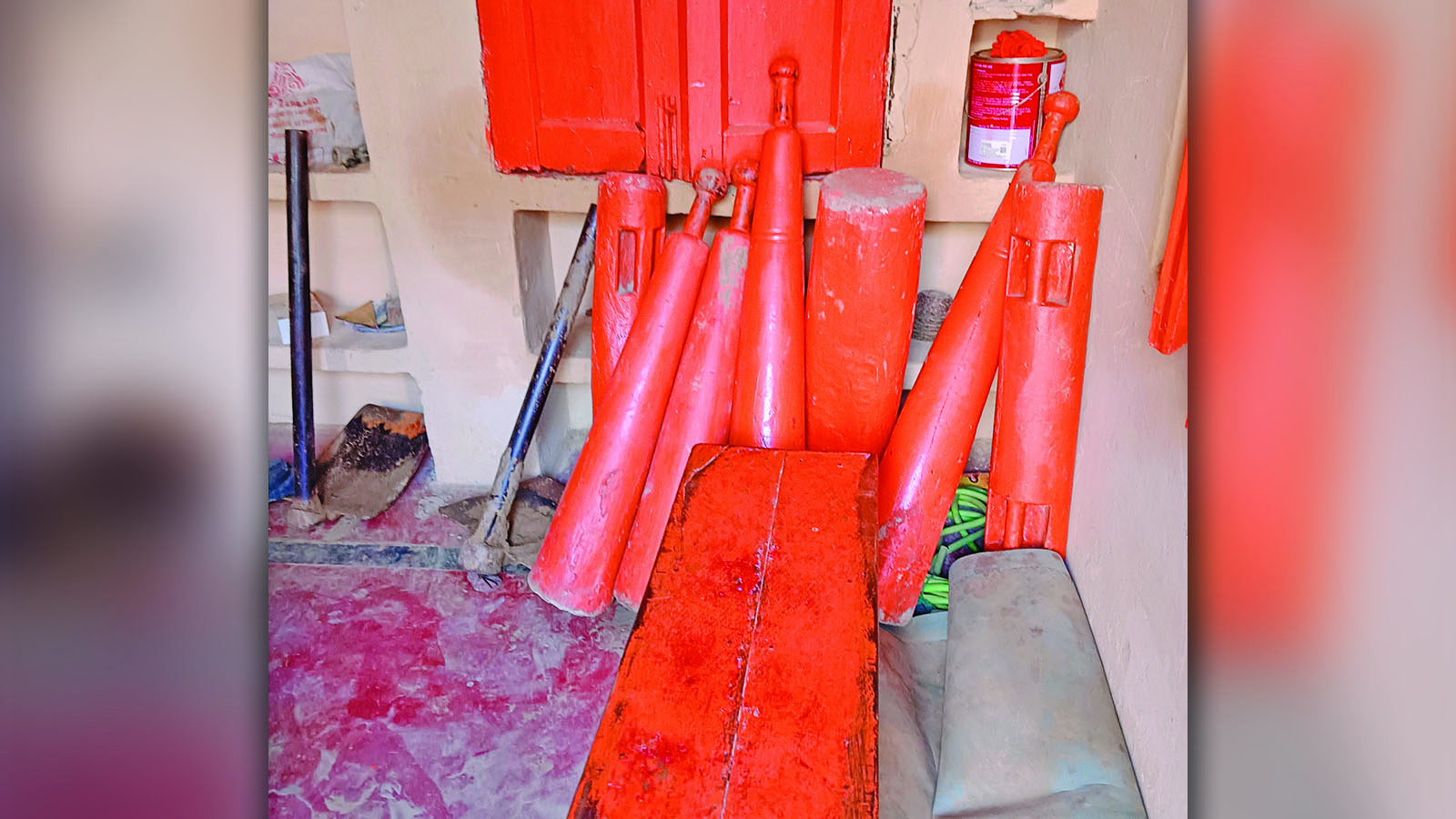 The wooden and stone equipment that wrestlers practice with at akhadas.