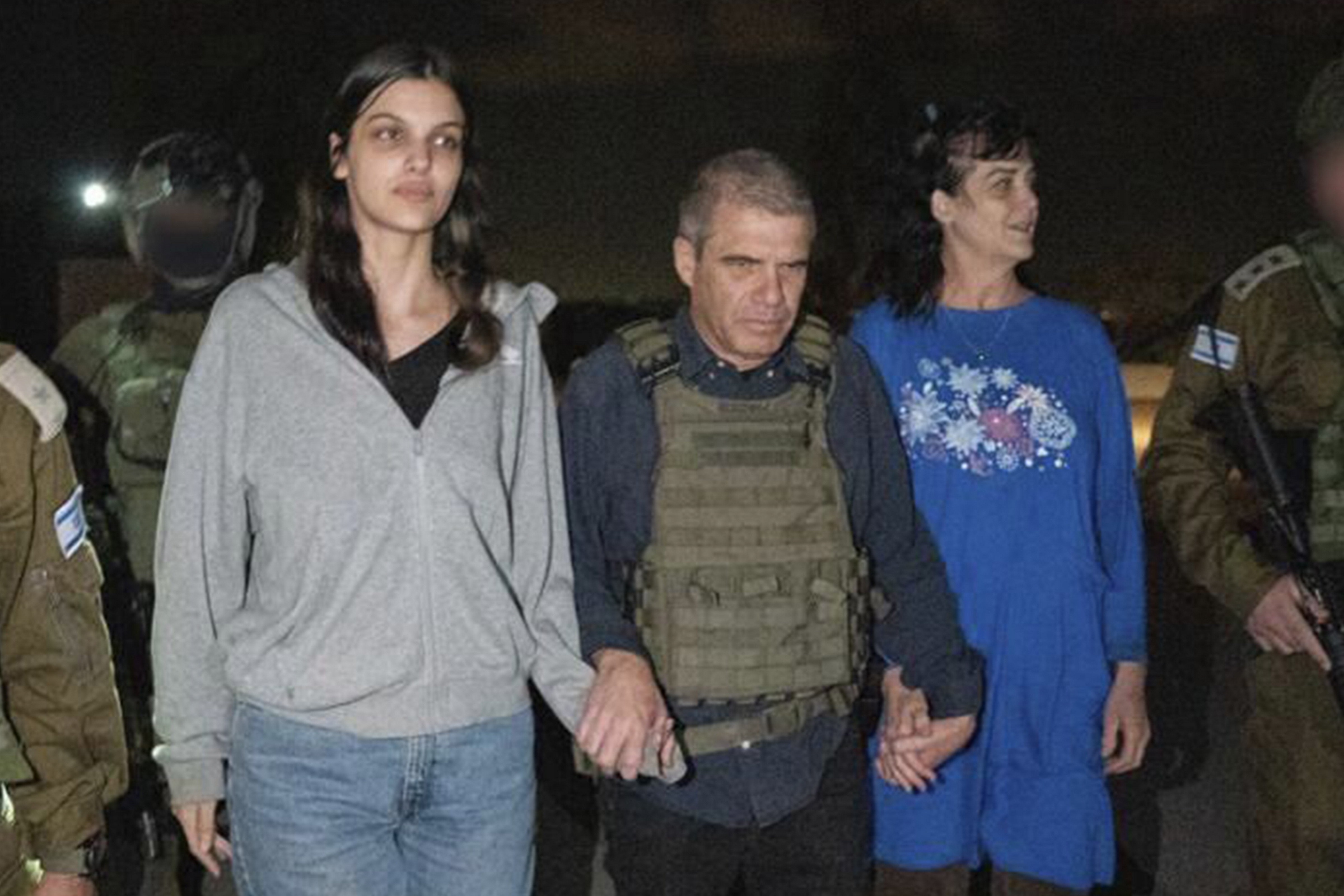 Judith Raanan, right, and her 17-year-old daughter Natalie are escorted by Israeli soldiers and Gal Hirsch, Prime Minister Benjamin Netanyahus special coordinator for returning the hostages, as they return to Israel from captivity in the Gaza Strip, Friday, Oct. 20, 2023. Hamas released the pair in what it said was a goodwill gesture late Friday, nearly two weeks after they were captured in a bloody cross-border raid by the Islamic militant group. AP/PTI