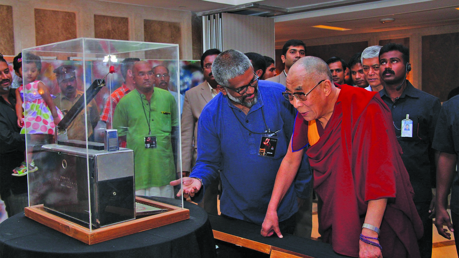 Sethu Das showing the 1000-1 Wavemagnet Transistor Radio to the Dalai Lama.