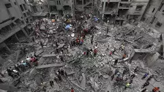 Palestinians inspect the damage of destroyed buildings following Israeli airstrikes on Gaza City late Friday (October 27)(AP/PTI Photo)