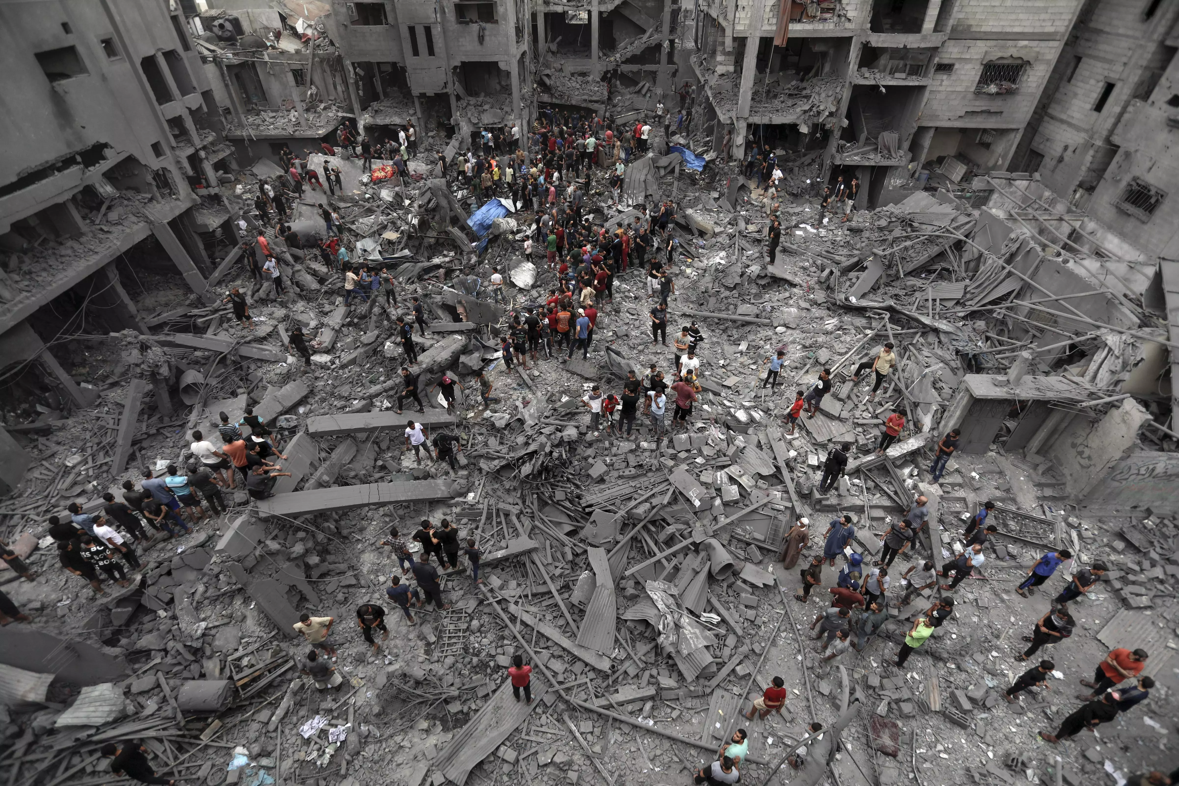 Palestinians inspect the damage of destroyed buildings following Israeli airstrikes on Gaza City late Friday (October 27)(AP/PTI Photo)