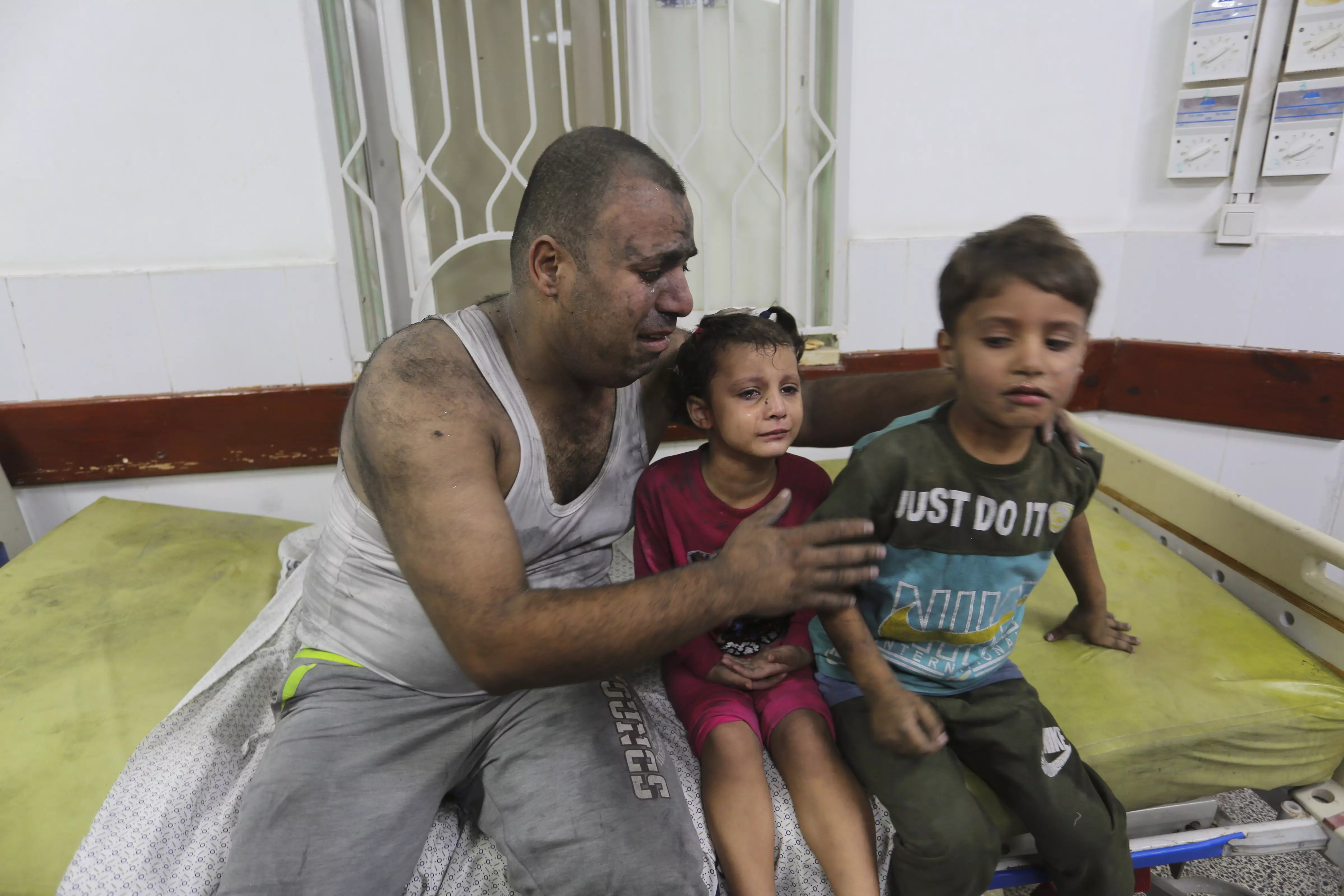 Palestinians wounded in an Israeli strike on the Gaza Strip wait for treatment in a hospital in Rafah on October 30 | AP/PTI