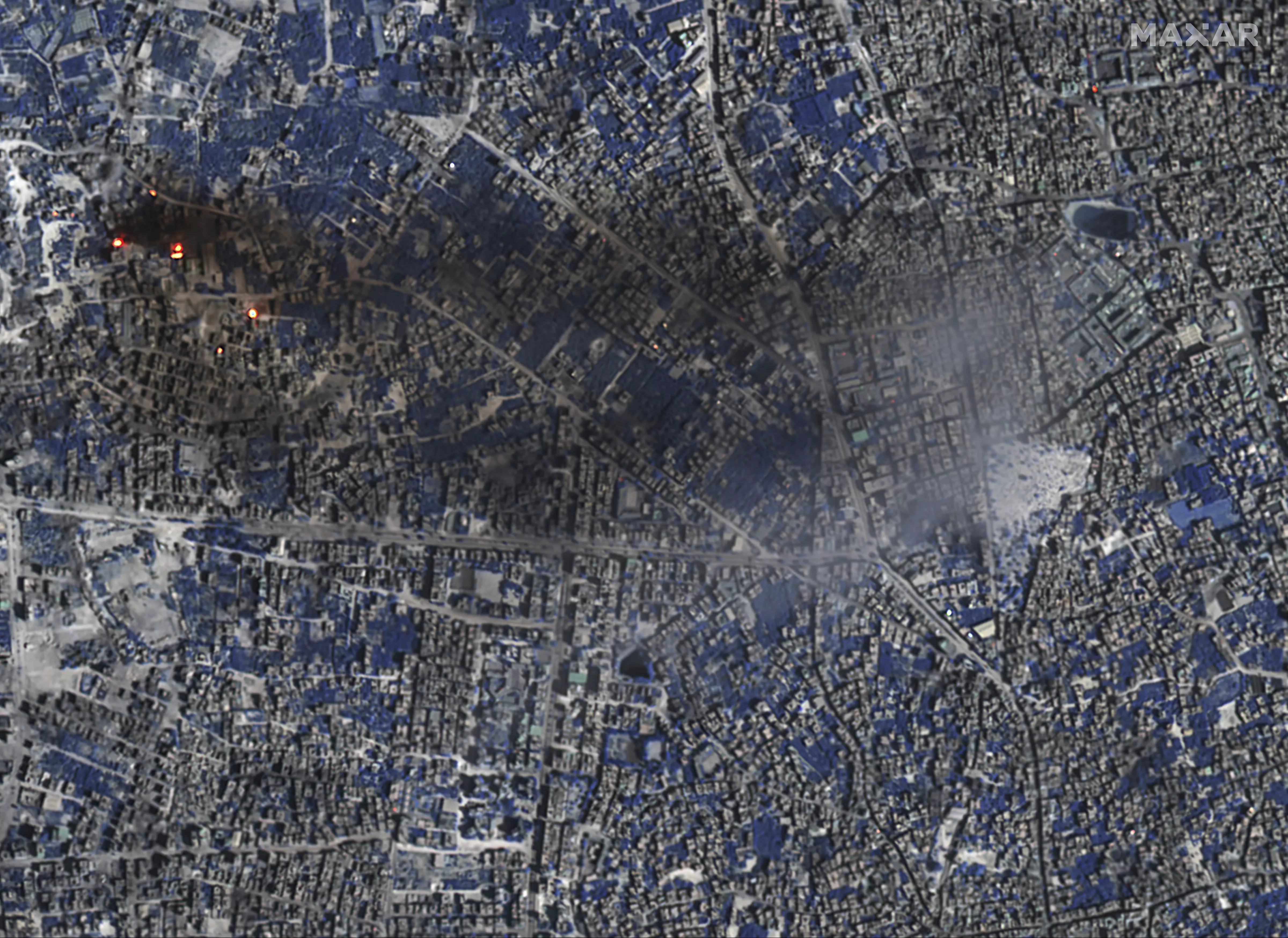 Satellite photos show a burning Gaza