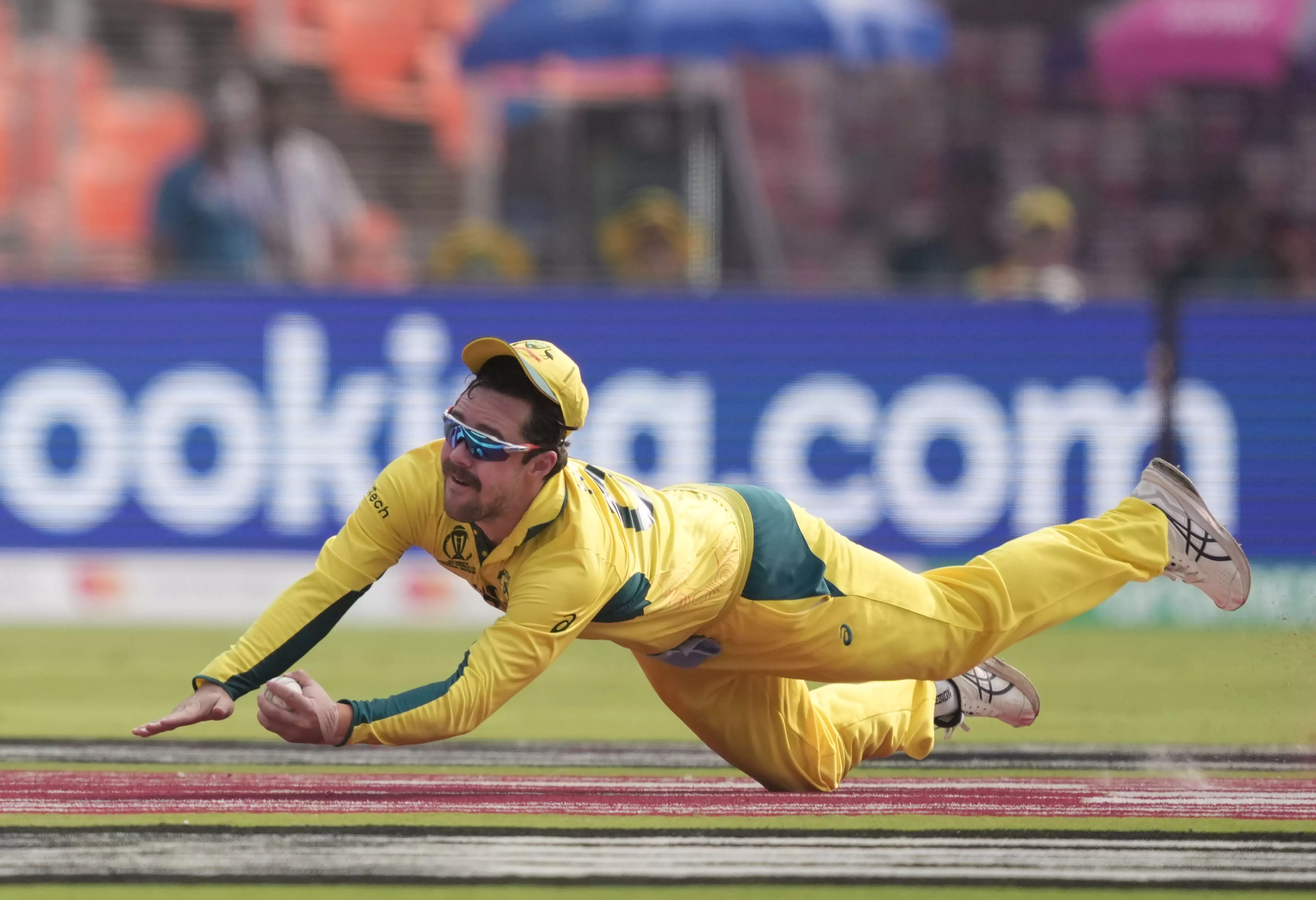 Travis Head takes a superb catch to get Rohit Sharma off Glenn Maxwell. Photo: PTI