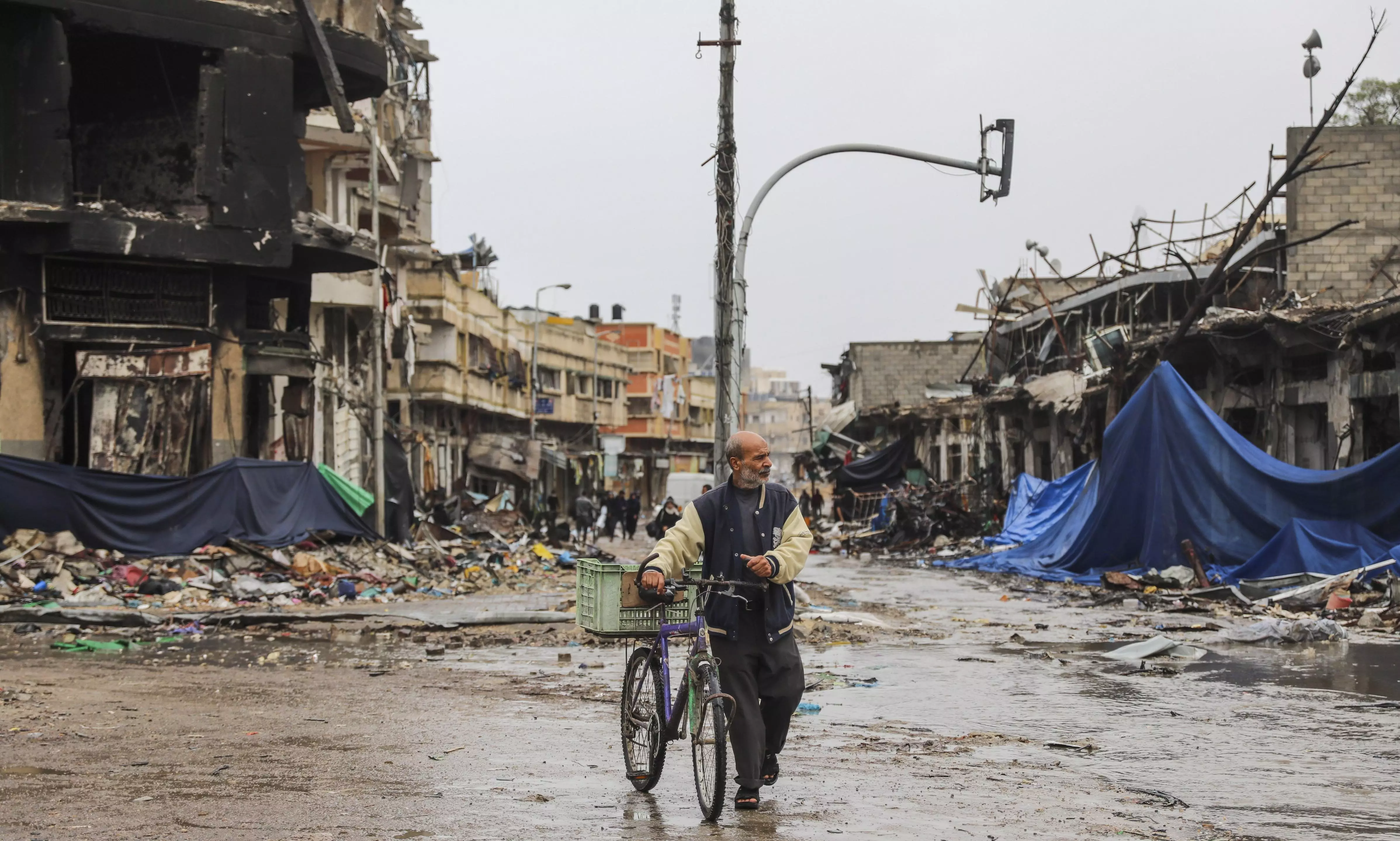 A Palestinian walks in Gaza City on November 27, the fourth day of the temporary ceasefire between Hamas and Israel | AP/PTI