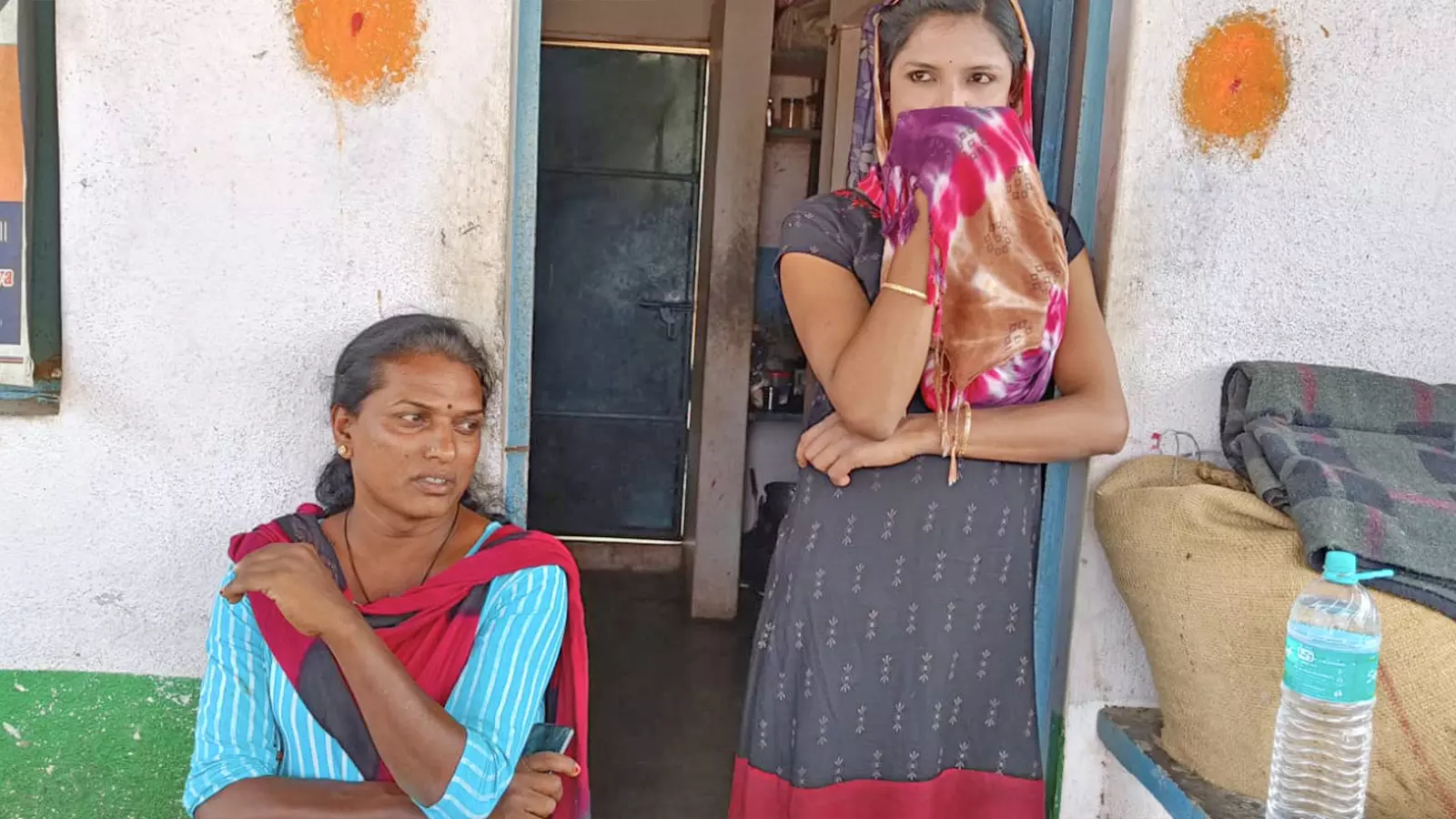 Arundhati (left) with a friend in her house in Karnatakas Kolahal village.