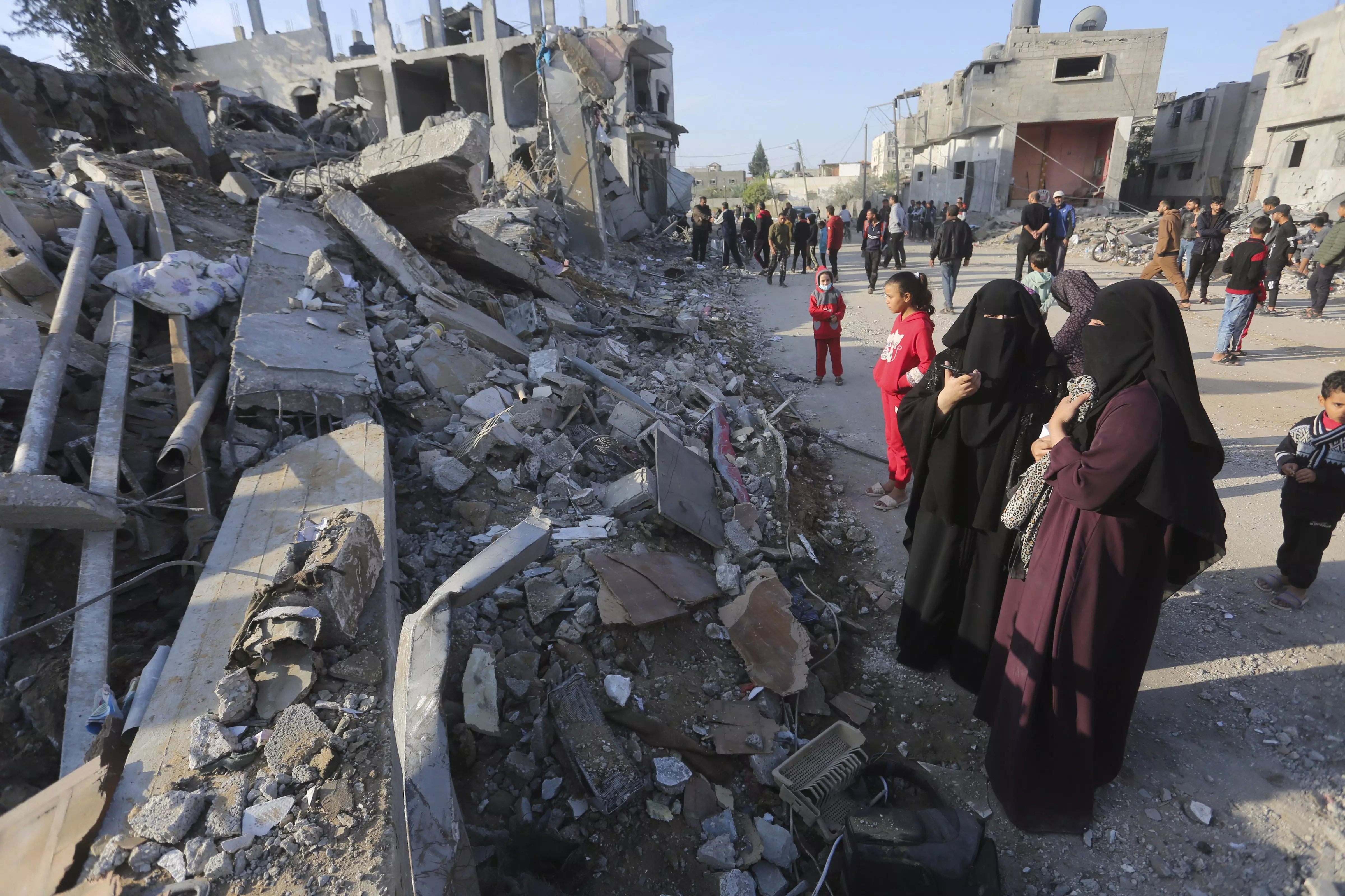Palestinians look at the destruction by the Israeli bombardment of the Gaza Strip in Rafah | AP/PTI