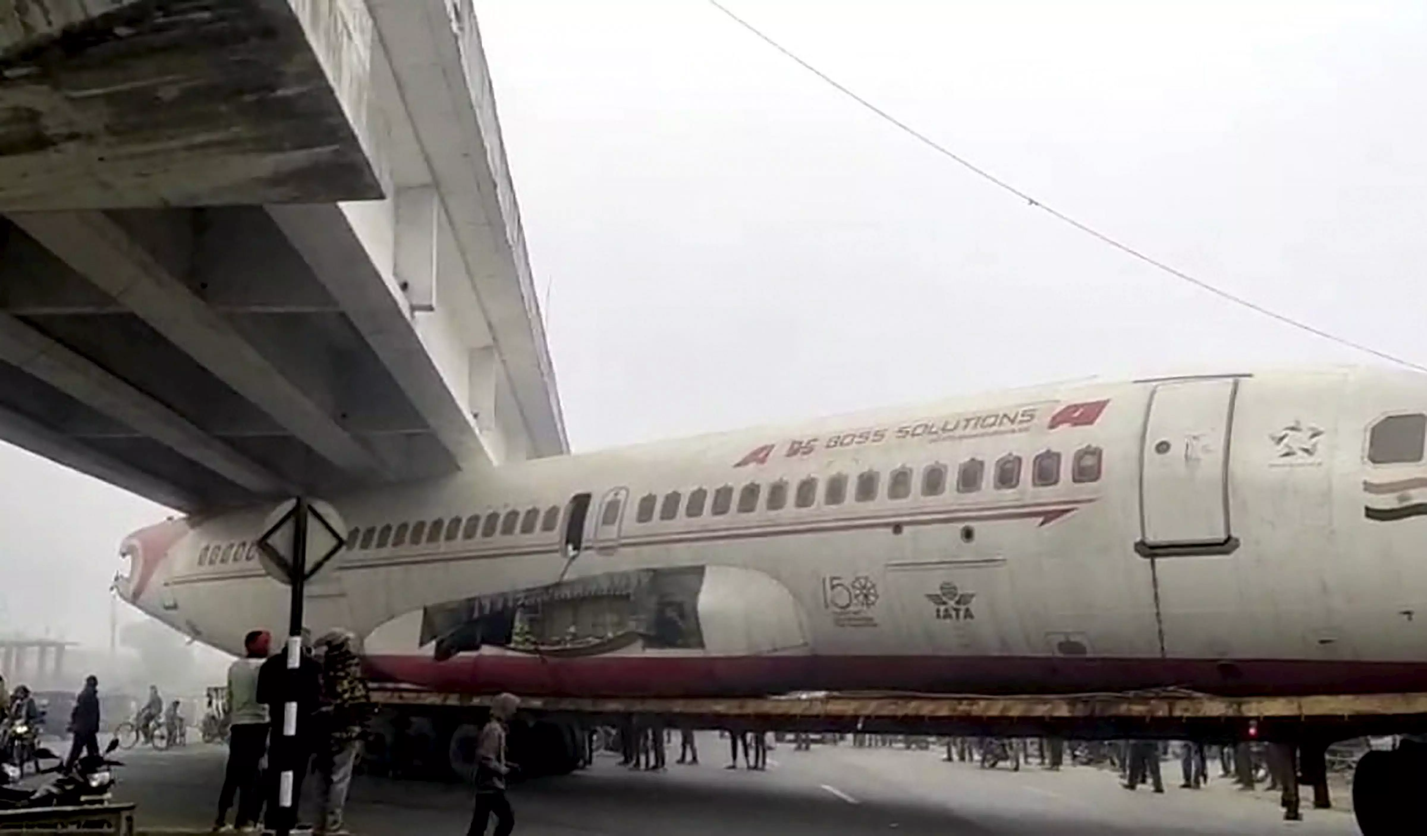 Junked plane on truck gets stuck beneath bridge in Bihars Motihari