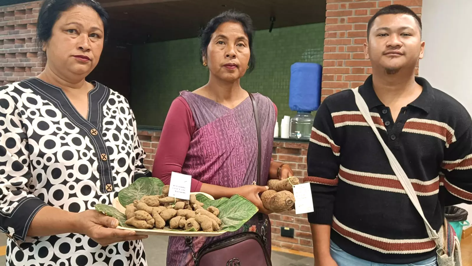 Arelcy Lyngdoh (left), Laitlin Lyngdoh (centre) and Kennyson Lyngdoh (right) pose for the camera as they promote Meghalayas tuber crops. Photos: Maitreyee Boruah