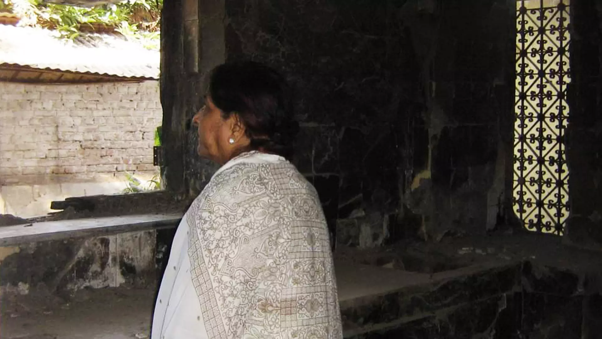 Zakia Jafri, widow of former Congress MP Ehsan Jafri, at her burnt down house.