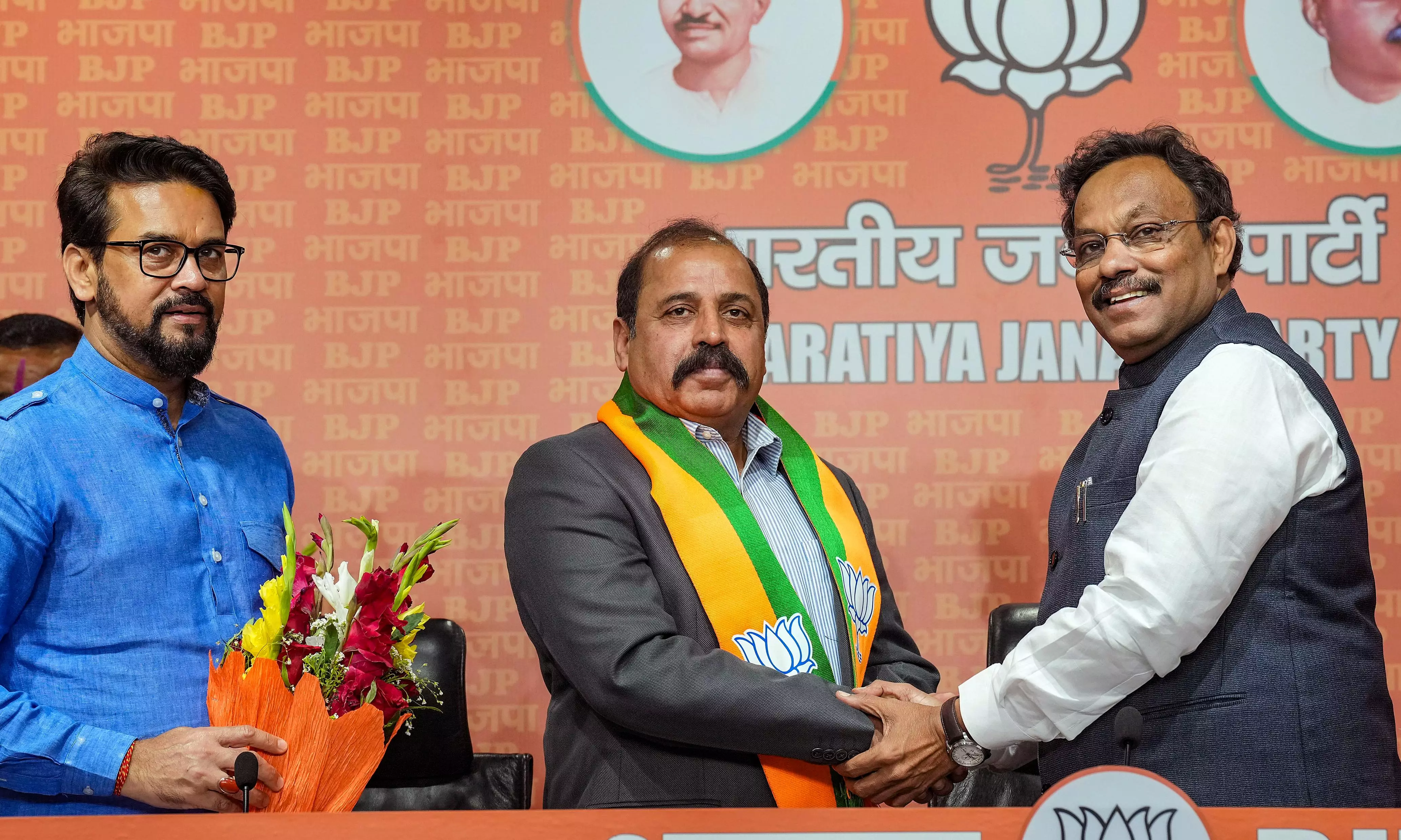 Air Chief Marshal (Retd.) RKS Bhadauria joins BJP in the presence of Anurag Thakur and Vinod Tawde. PTI