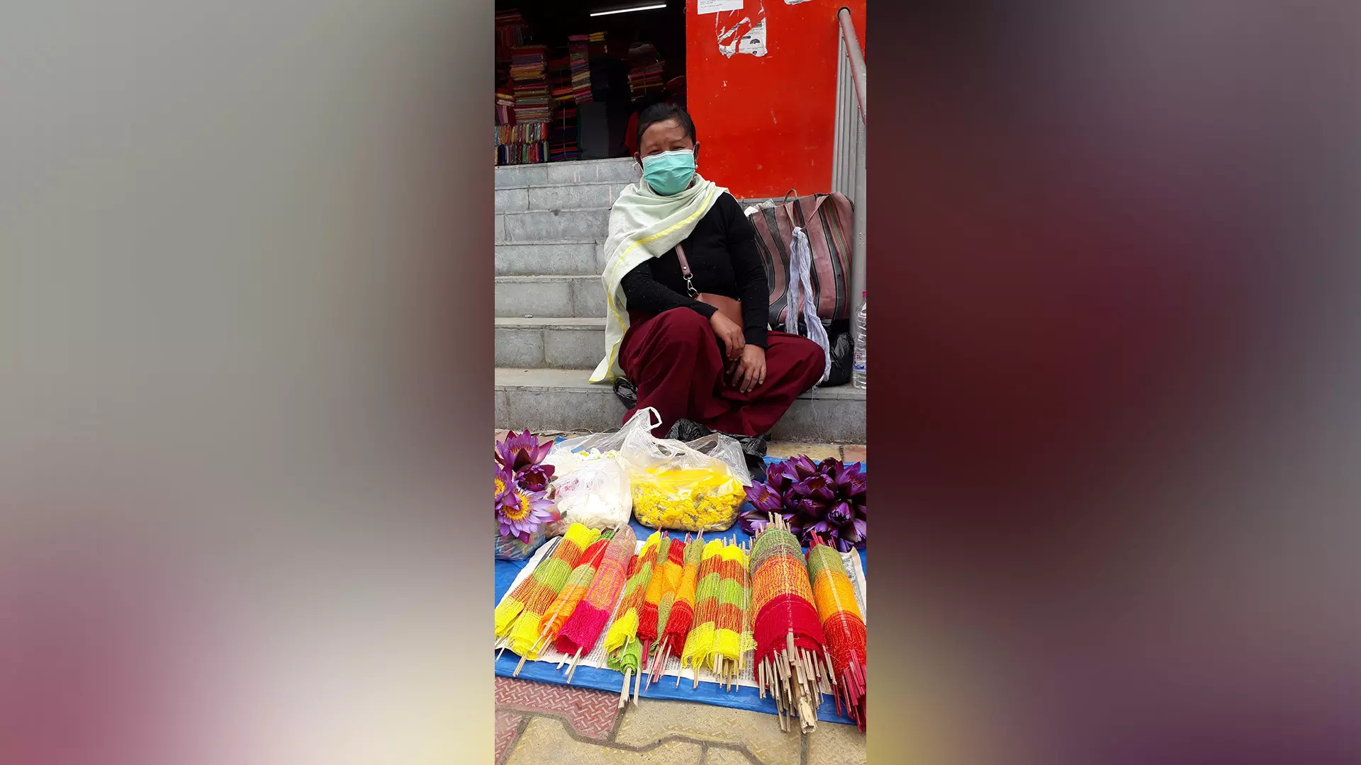 A Manipuri woman with Holi articles at Ima Market.