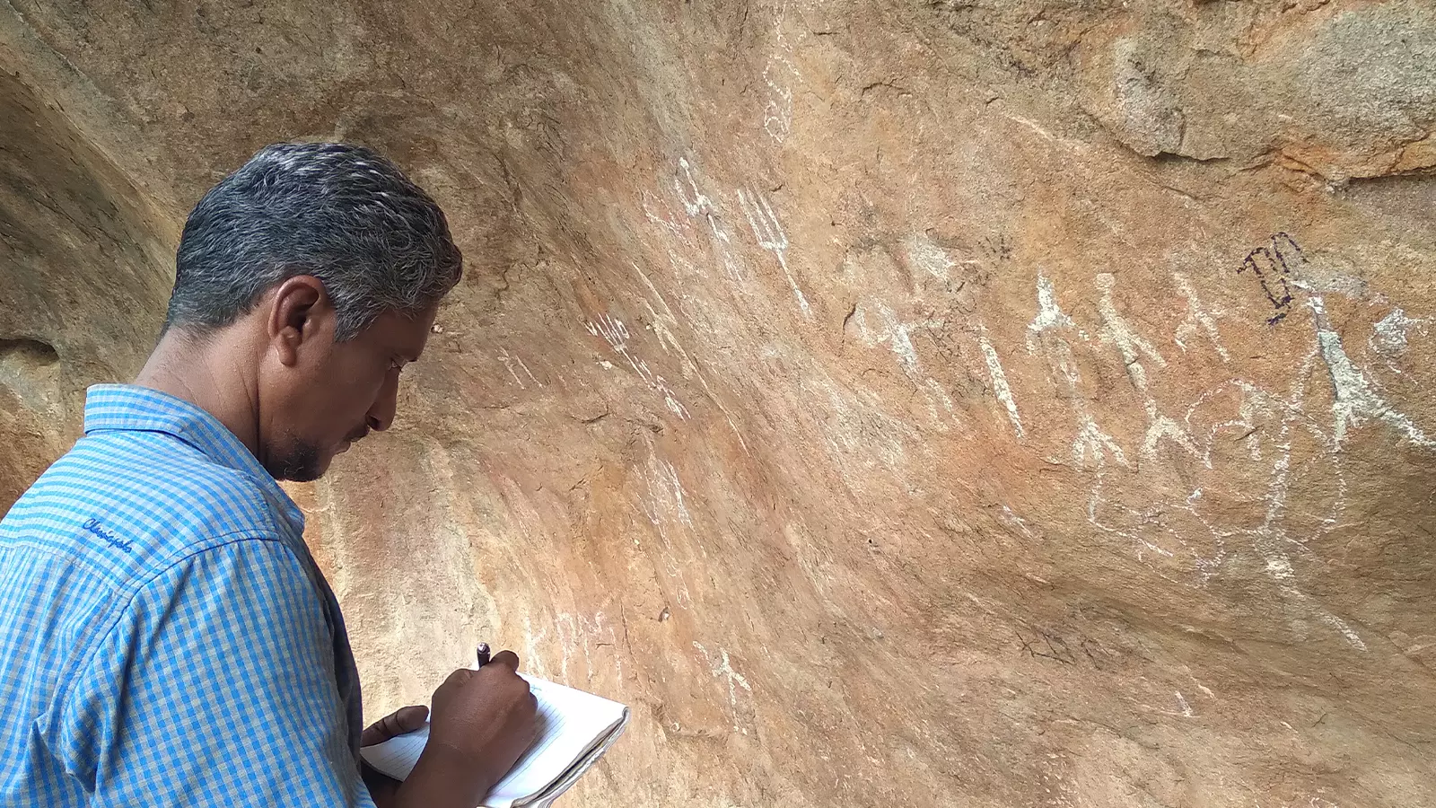 Gandhirajan at a rock art site in Tamil Nadu.