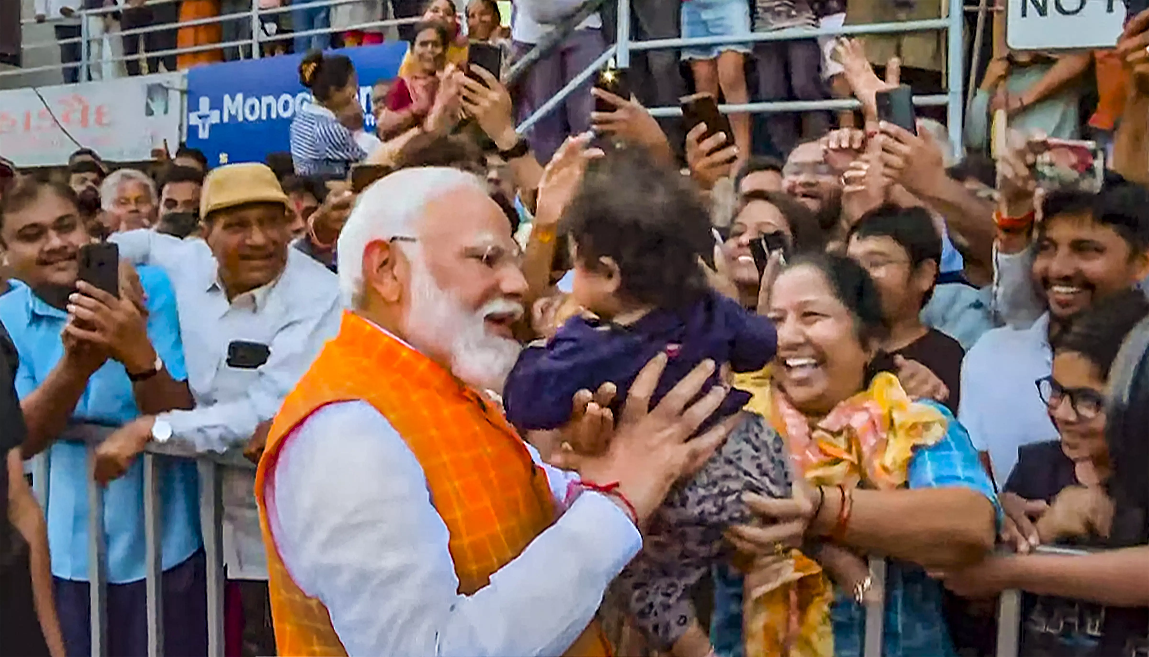 PM Modi meets people and signs autographs after casting his vote in Ahmedabad on Tuesday | PTI