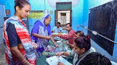 Voting process on at a polling station in Kheda, Gujarat,
