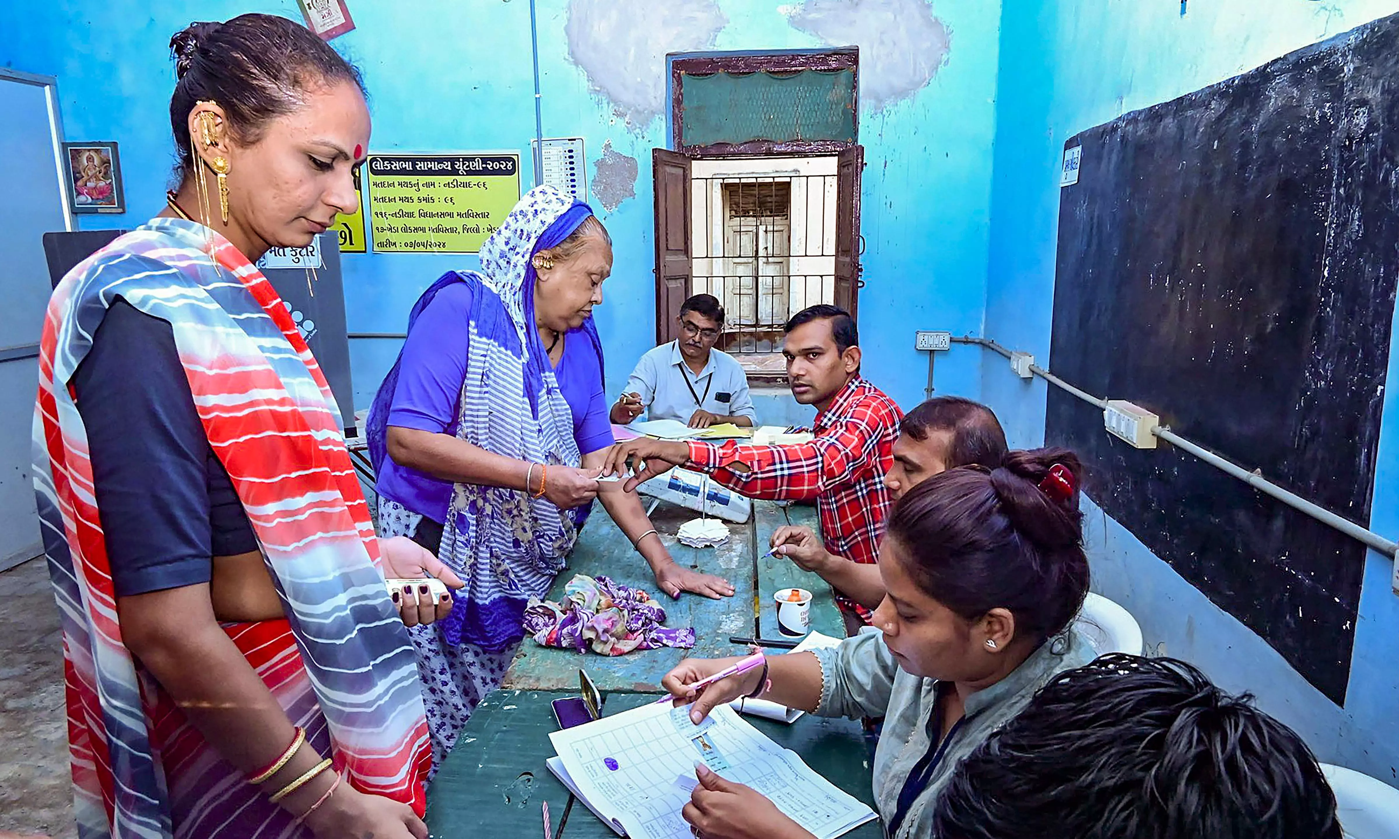 Voting process on at a polling station in Kheda, Gujarat, Voting process on at a polling station in Kheda, Gujarat,