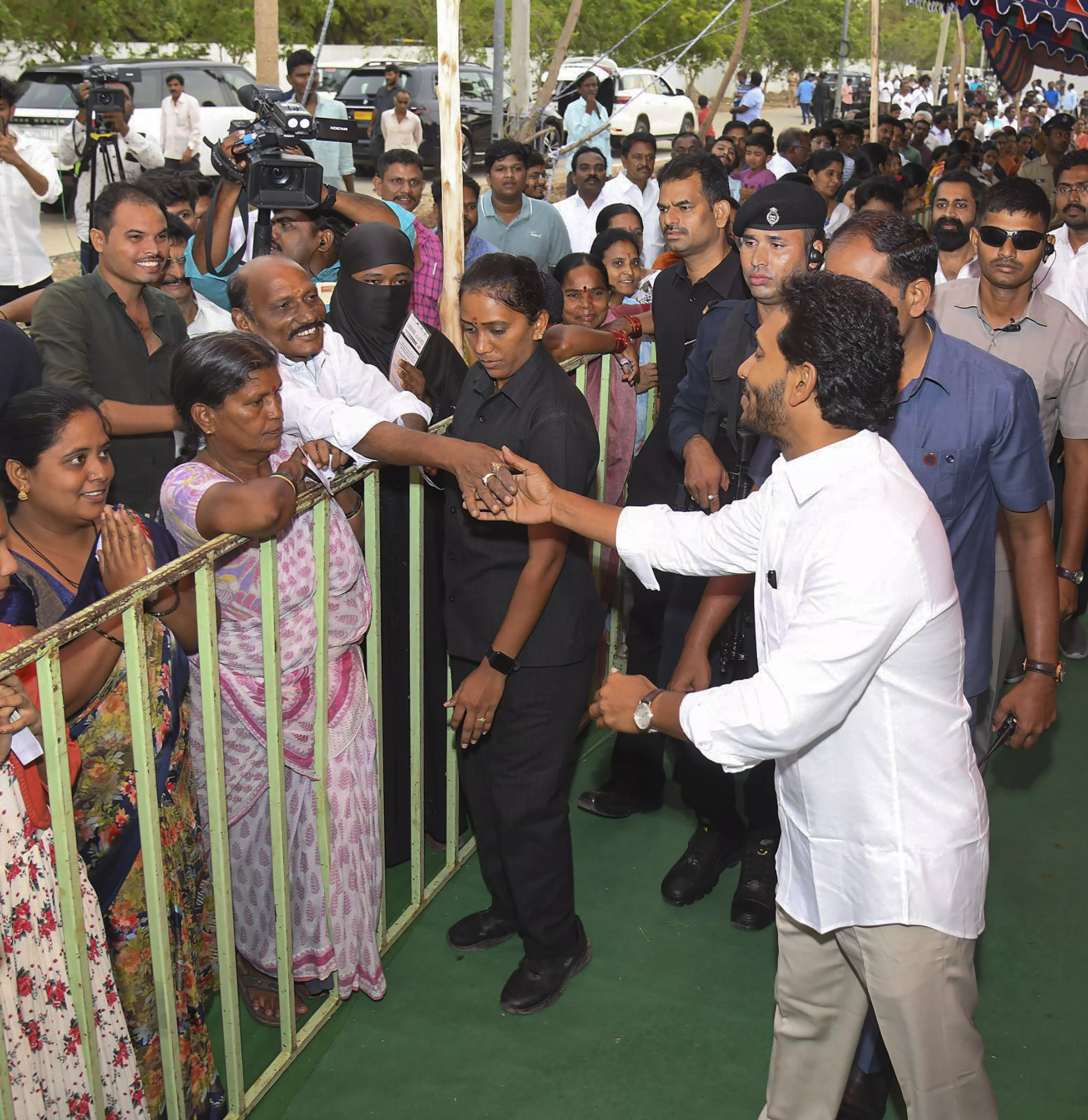 Andhra Pradesh Chief Minister YS Jagan Mohan Reddy meets people as he arrives to cast his vote during the fourth phase of Lok Sabha elections, in Pulivendu, Andhra Pradesh, Monday, May 13. PTI